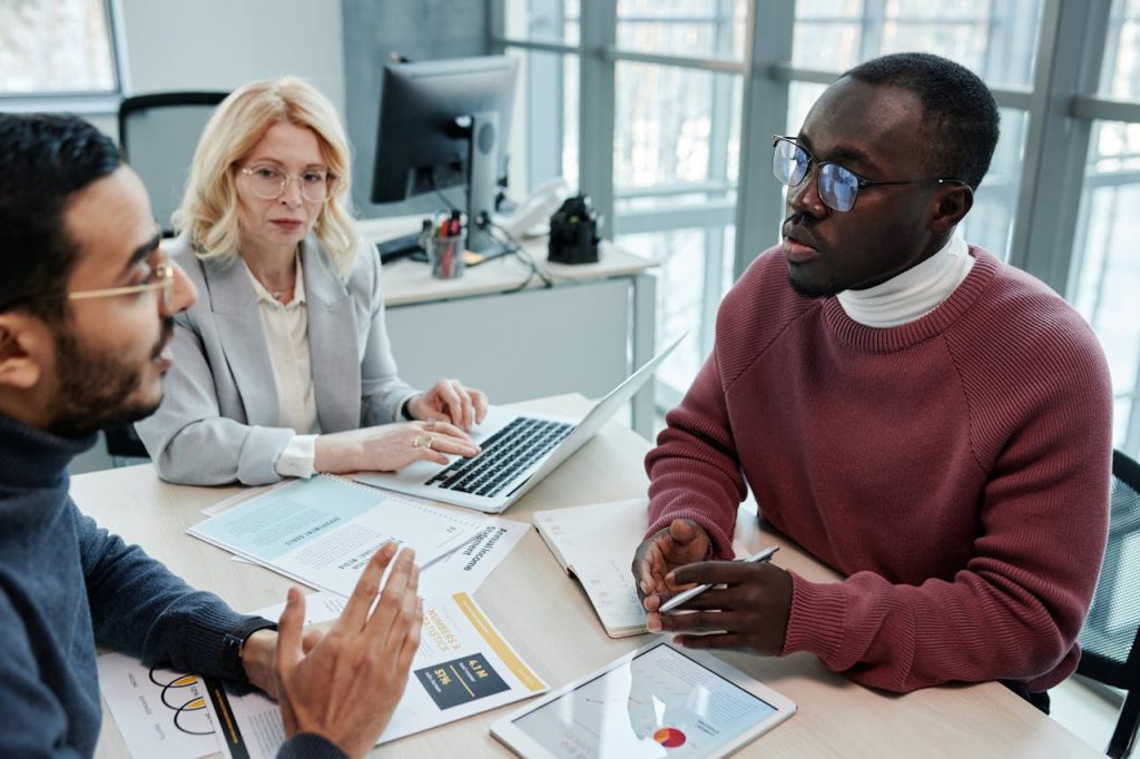 A Group of People Having a Meeting in the Office